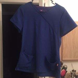 Woman’s blue scrub top